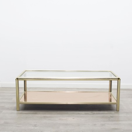 Mesa de centro metálica dorada y cristal transparente y revistero